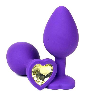 Фиолетовая силиконовая анальная пробка с желтым стразом-сердцем - 10,5 см.