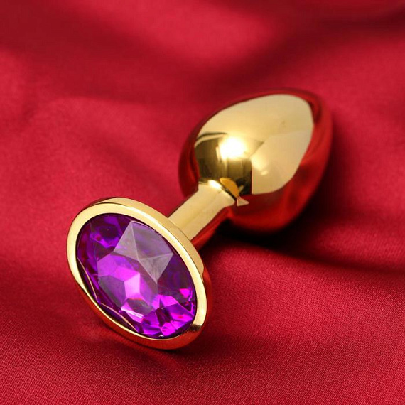 Золотистая анальная пробка с фиолетовым кристаллом - металл