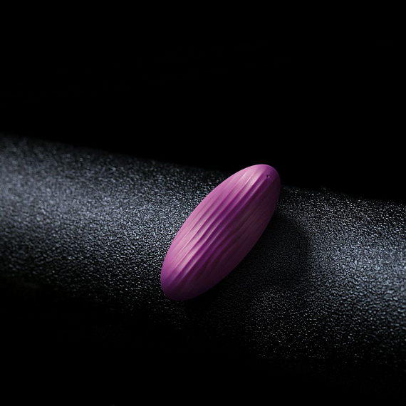 Фиолетовый клиторальный стимулятор Edeny с управлением через приложение Svakom