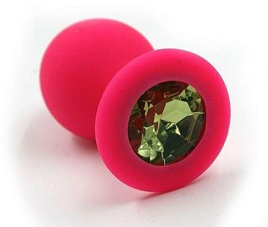 Розовая силиконовая анальная пробка с светло-зеленым кристаллом - 7 см.