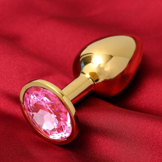 Золотистая анальная пробка с розовым кристаллом - металл