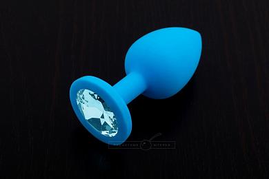 Маленькая голубая силиконовая пробка с голубым кристаллом - 7,5 см.